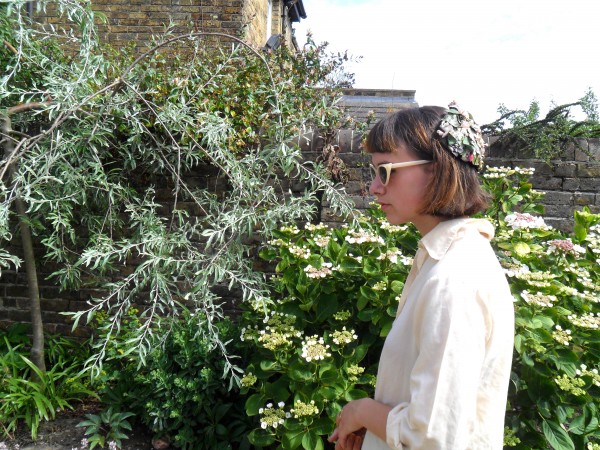 Artist Frieda Ford wore a vintage floral headpiece